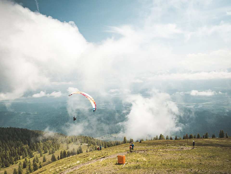 Watching paragliders descend is an experience that you wouldn’t miss
