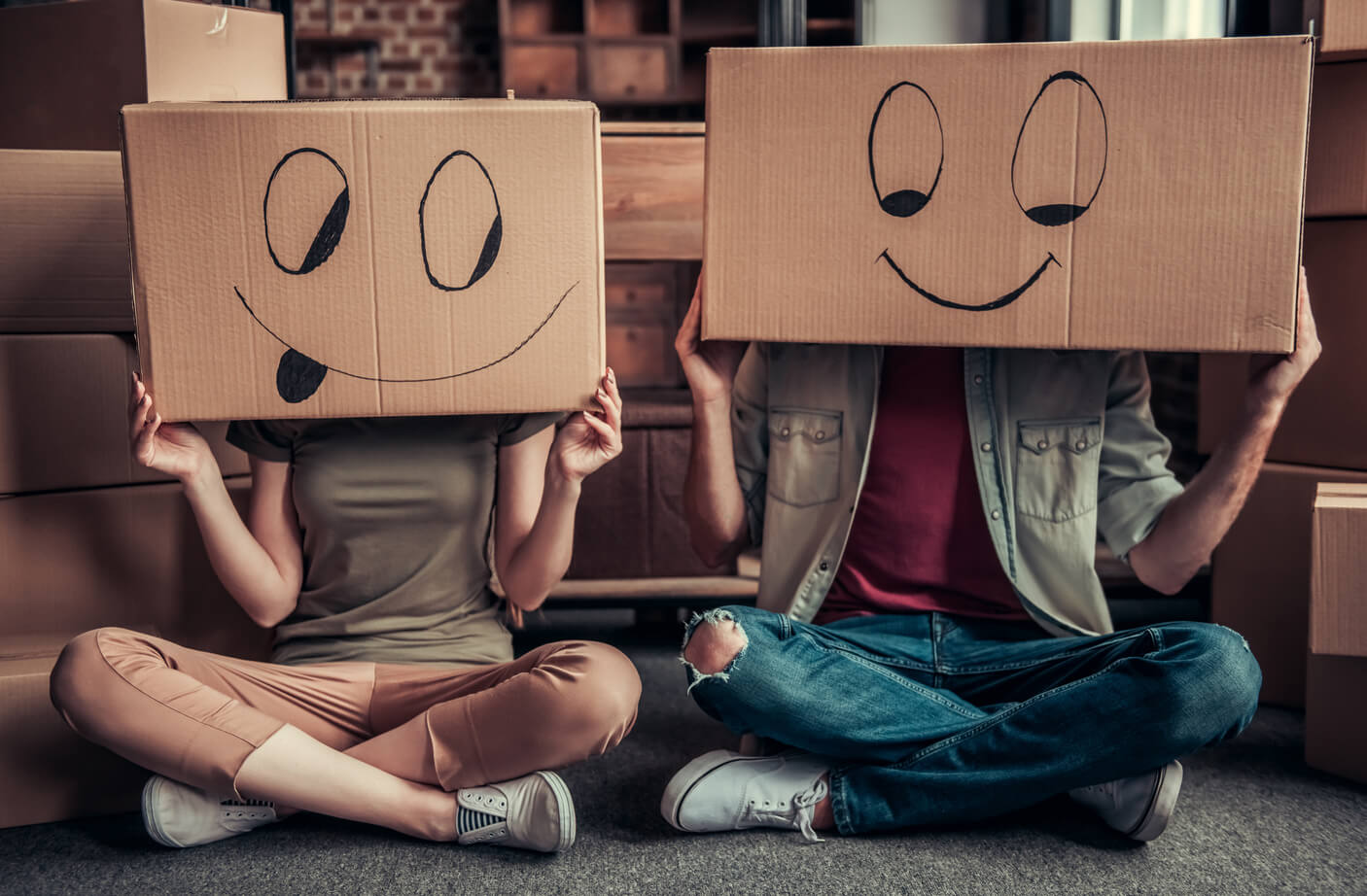 Two people with boxes on their heads