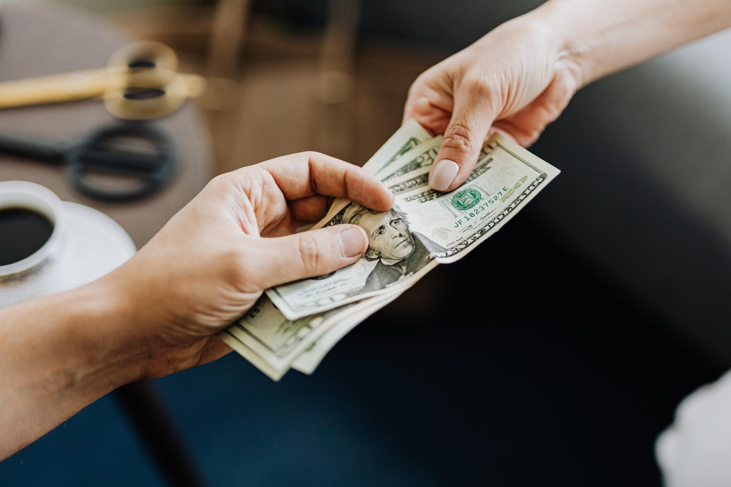 a woman handing  a tip