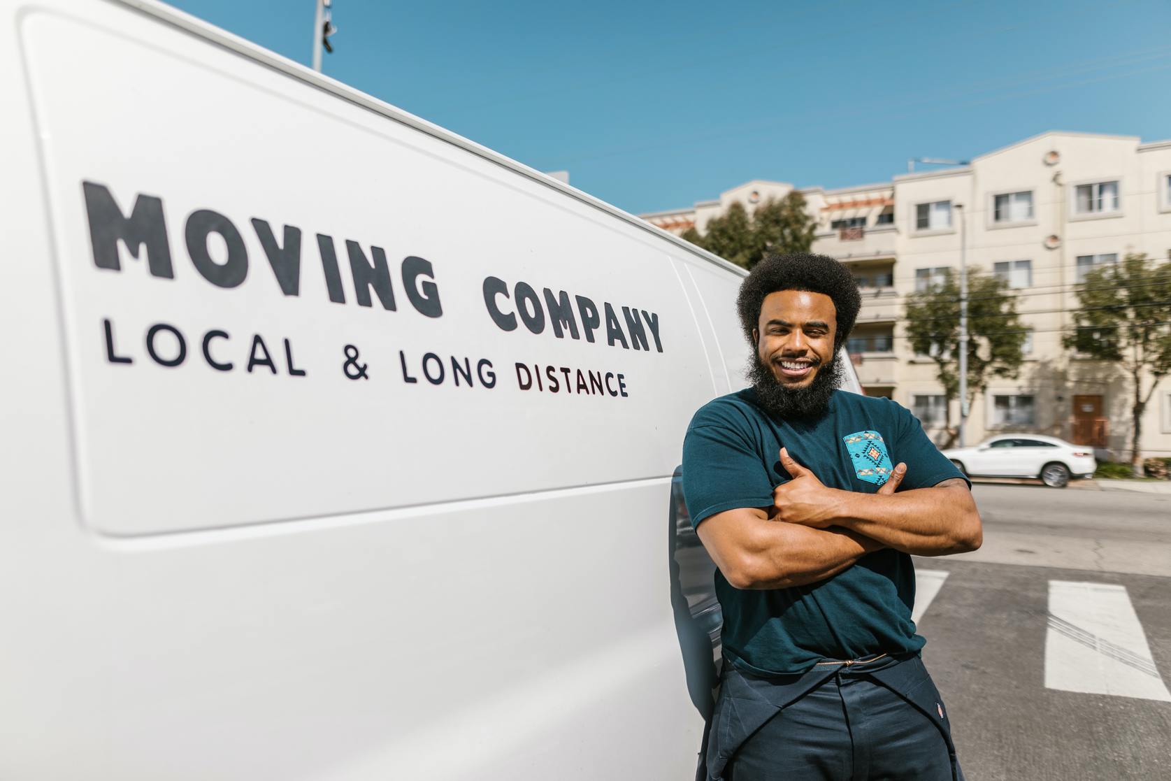 professional mover in front of its white relocation truck