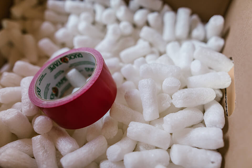 Foam peanuts and tape in a box