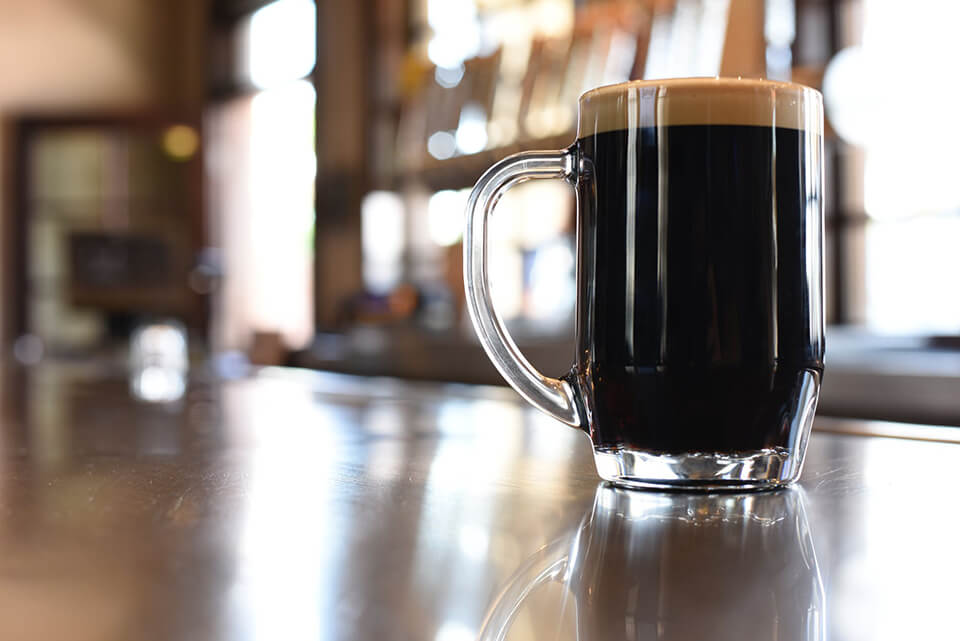 A full beer mug on a table