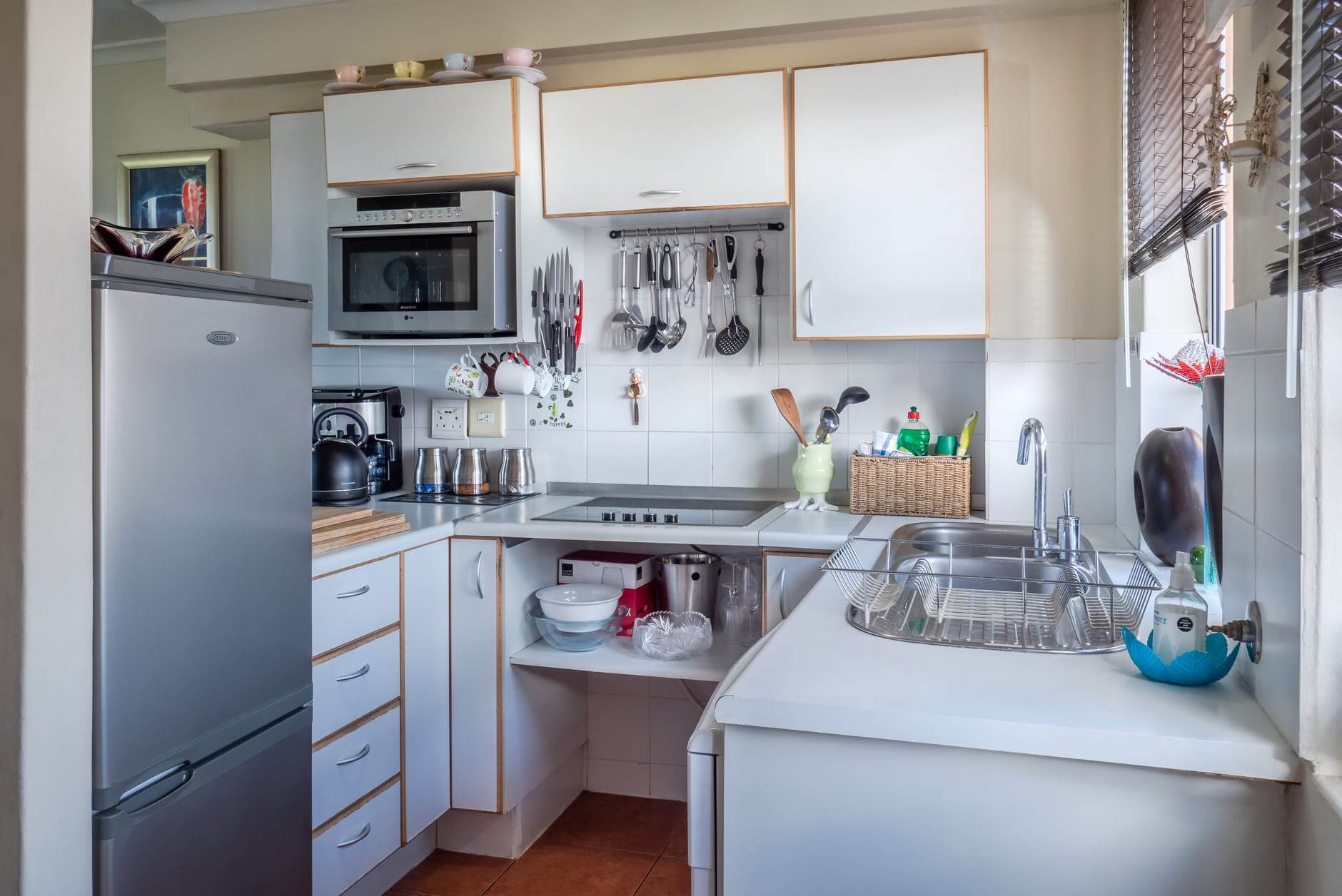 A kitchen with narrow cabinet units