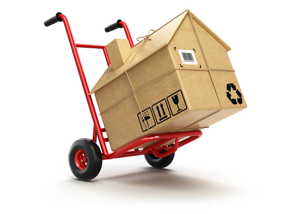 a dolly transporting a small wooden house
