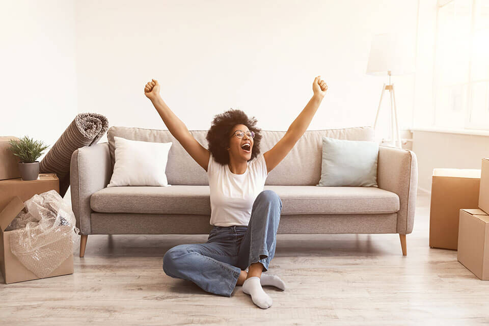 A woman happy that she used a moving company app