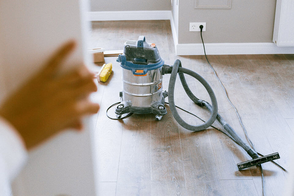 Vacuum cleaning after a moving company is gone