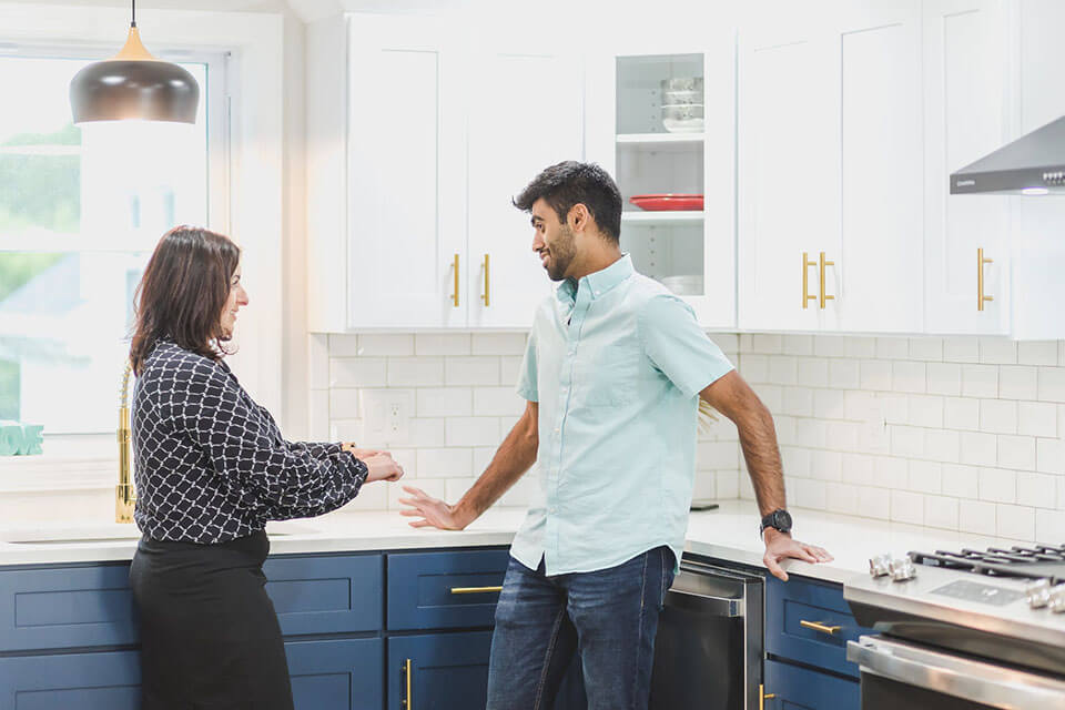 Realtor talking to a client about a moving company