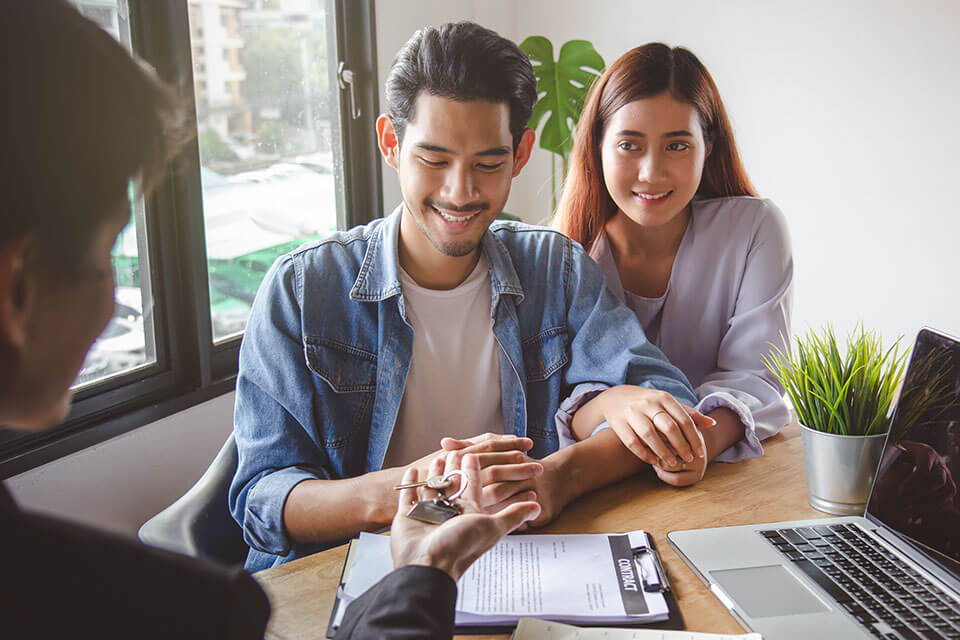 a young couple getting a home together after using a moving app