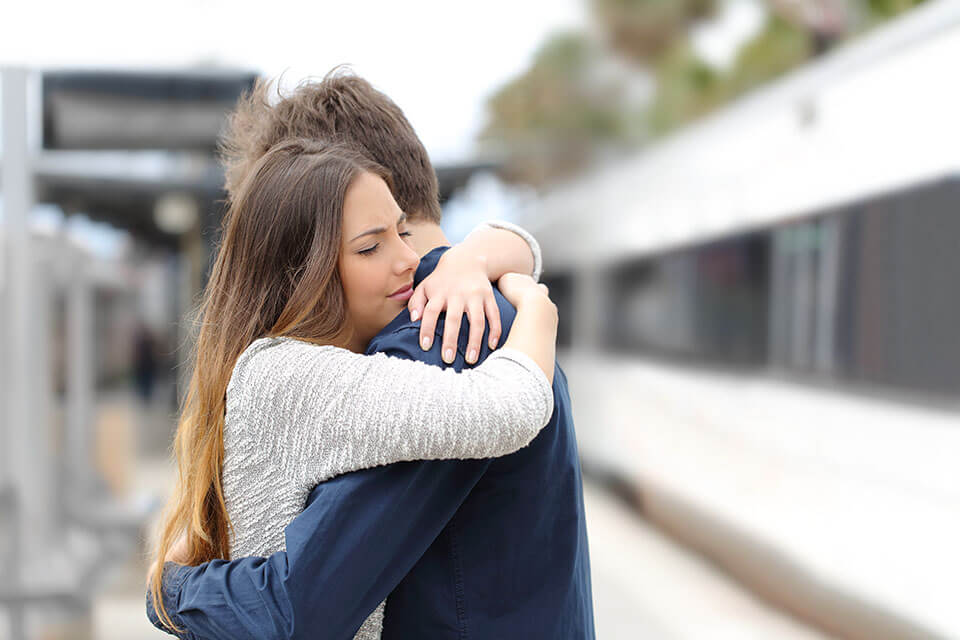 A couple hugging each other after searching for moving companies