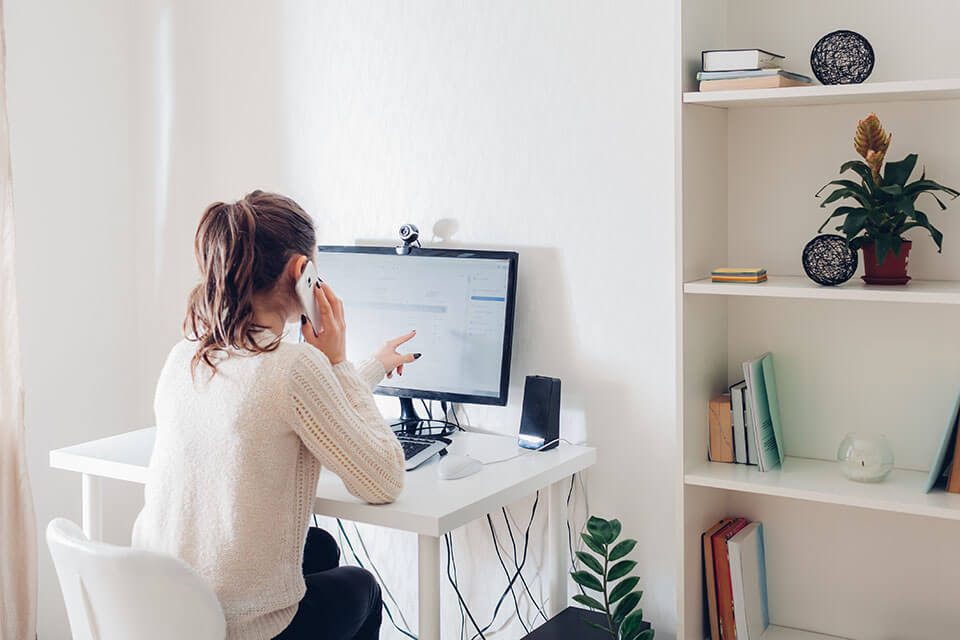 A woman calculating how much she needs to pay for an app for moving