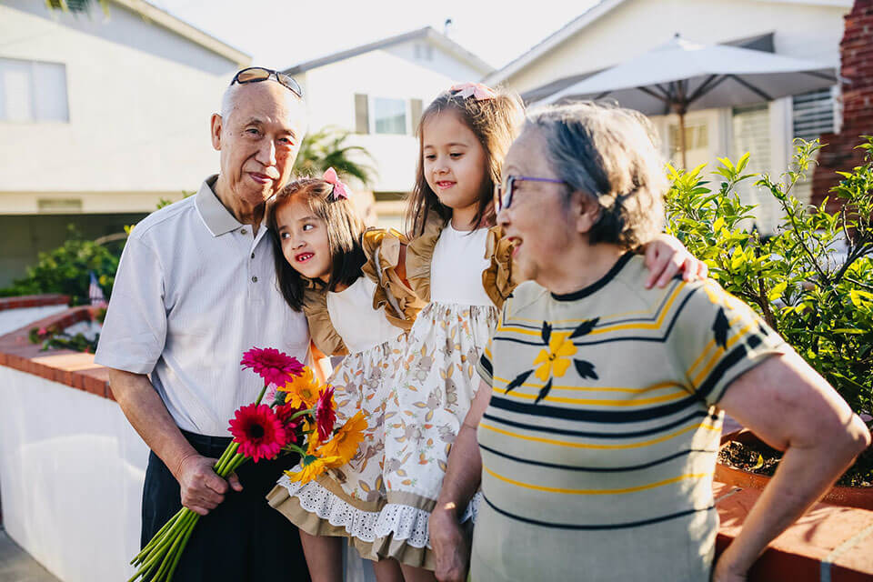 Grandparents and their grandchildren enjoying a sunny day