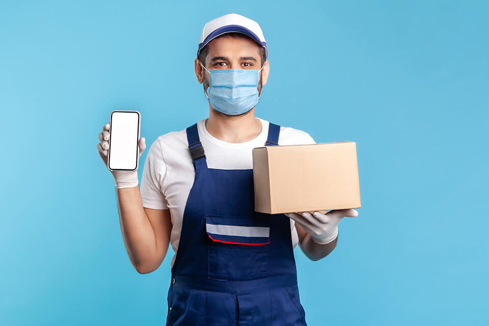 A mover showing a moving company app on his phone