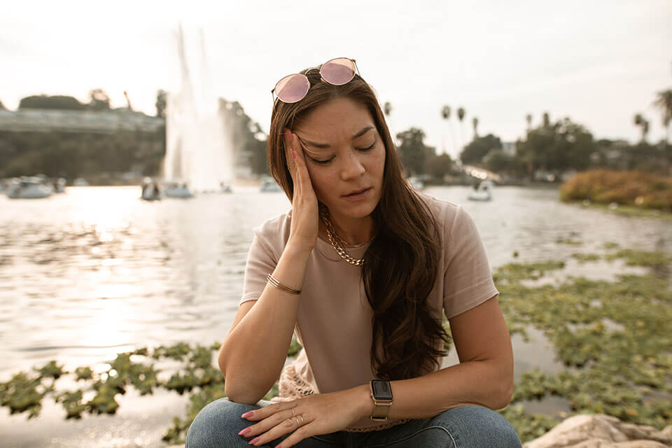 Girl in a park after relocating with a company she found on the app for moving